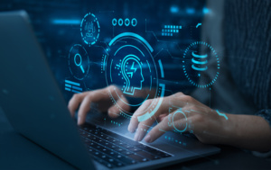 Mão digita em computador; imagem aparece sob símbolos de tecnologia e inteligência artificial